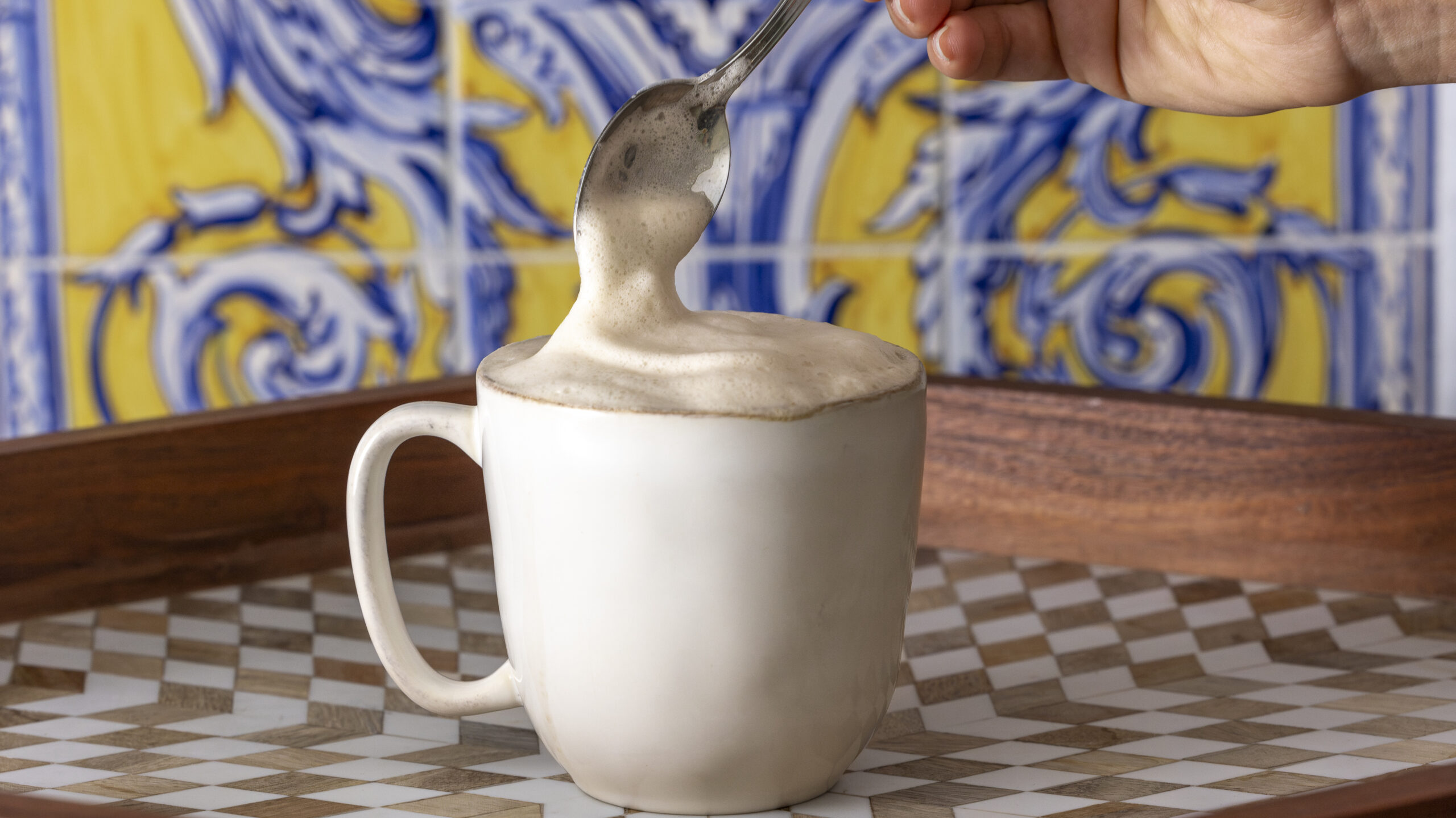 A barista-style foamy latte made with Wholy M!lk, showing how smoothly it steams and froths.